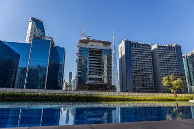 a view of a city skyline with tall buildings at BurjKhalifa View | 1BR Business Bay Near Dubaimall in Dubai