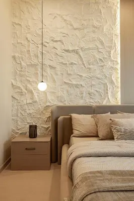 a bedroom with a bed and a side table with a lamp at Elegantly crafted 5 Bedroom with Marina View in Dubai