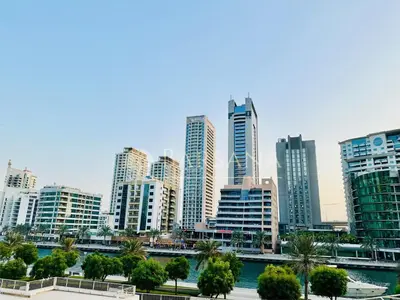 a city skyline with tall buildings and a river at Barsana - Jumeirah Beach Villa - 2BDR - Marina Views in Dubai
