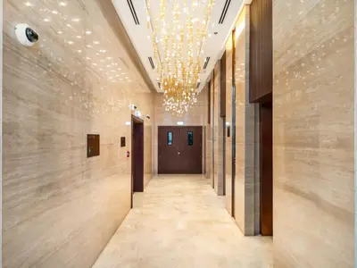 a hallway in a building with a chandelier at Cozy modern STUDIO in STERLING DOWNTOWN I DUBAI MALL I Sleeps 4 in Dubai