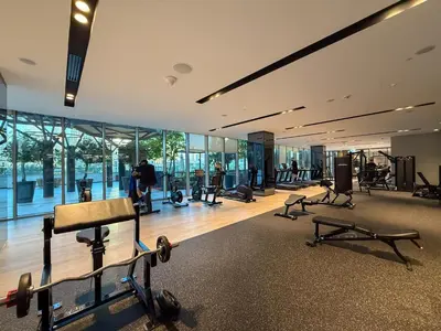 a gym with a lot of exercise equipment in a building at Grande Signature Residences in Dubai