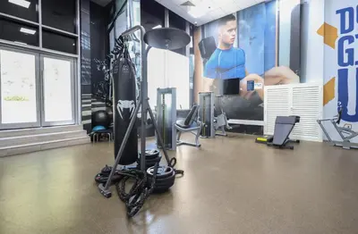a gym with a treadmill and a bike at Elite LUX Holiday Homes - Stylish 1BR Living in Amna Tower, Al Habtoor City in Dubai