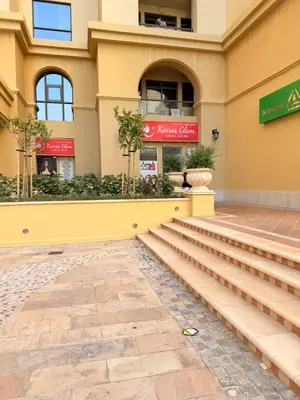 a building with stairs in front of a building at Spacious & classic Apartment in center of JBR in Dubai