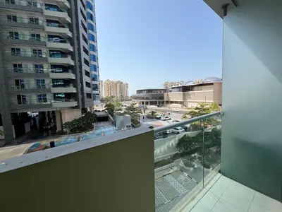 a balcony with a view of a city at Beach access, next to shopping mall in Dubai