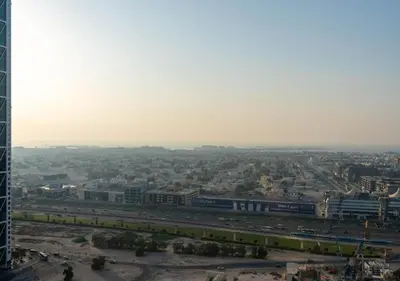 an aerial view of a city with a train at Forte Luxury 2BR Apartment with Skyline City Views near Dubai Mall in Dubai