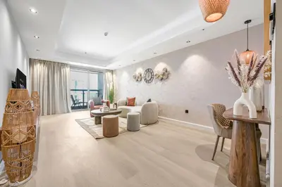 a living room with a couch and a table at Ample space 2BR Princess towers Marina in Dubai