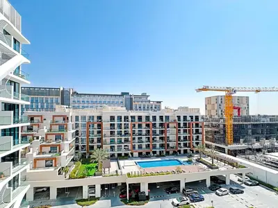 an aerial view of a building with a crane at Stylish Contemporary Studio in Oxford Gardens in Dubai