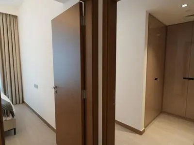 a room with a door and a hallway with a bedroom at Urban Oasis by Missoni in Dubai