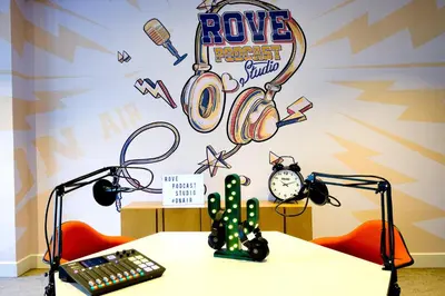 a room with a table with a keyboard and a cactus at Rove Downtown in Dubai