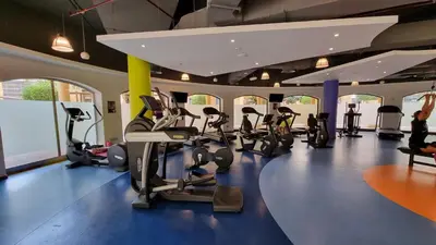 a gym with treadmills and elliptical machines at Luxury Sea View Beachfront 3 Bedroom Apt, JBR in Dubai