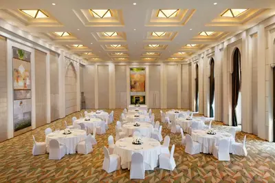 a banquet hall with white tables and white chairs at Shangri-La Dubai in Dubai