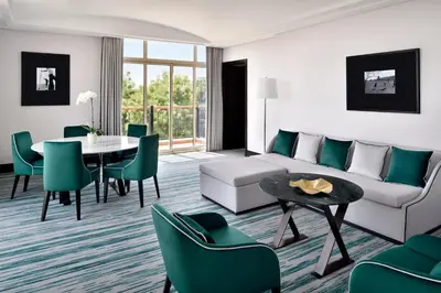 a living room with a couch and a table at Address Montgomerie in Dubai