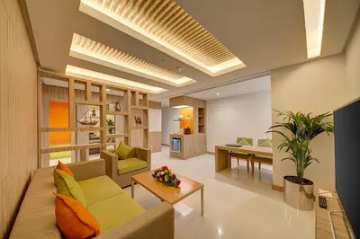 a living room with a couch and a table at Al Khoory Atrium in Dubai