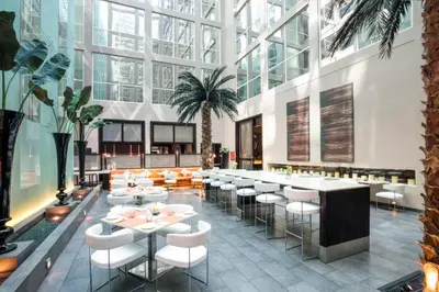 a rendering of a restaurant with tables and chairs at Centro Barsha - by Rotana in Dubai