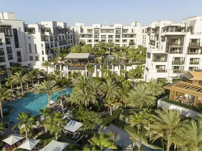 an aerial view of a resort with palm trees and buildings at Jumeirah Al Naseem Dubai in Dubai