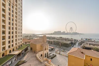 an aerial view of a city with the ferris wheel at Elan Rimal Suites in Dubai