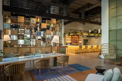 a large room with chairs and a large table in it at Rove Bur Dubai - Healthcare City in Dubai