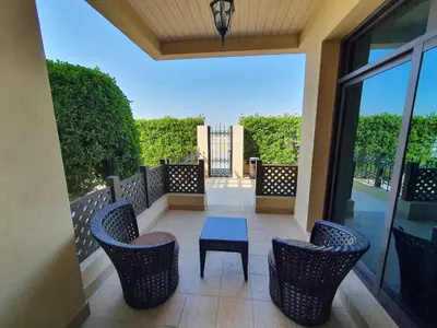 a patio with chairs and a table on a balcony at Roda Beach Resort in Dubai