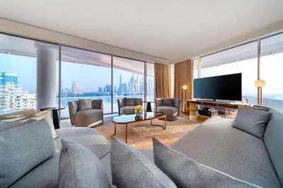 a living room with a couch and a television at FIVE Palm Jumeirah Dubai in Dubai