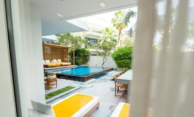 a view of a swimming pool from the balcony of a house at FIVE Palm Jumeirah Dubai in Dubai