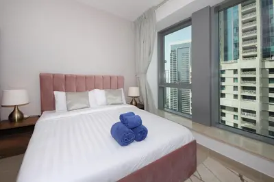 a bedroom with a large bed with blue teddy bears on it at New Arabian 29 Boulevard Downtown in Dubai