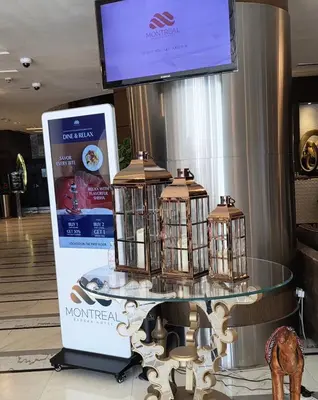 a table with three bird cages on top of it at Montreal Barsha Hotel in Dubai
