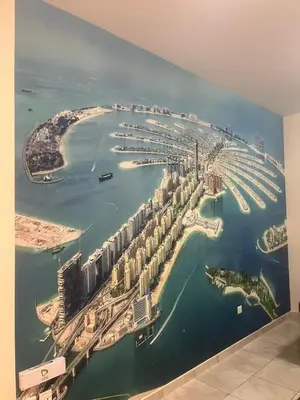 a mural of a city on the wall of a room at Al Raya Hotel Apartments in Dubai