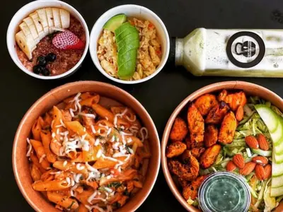 a group of four bowls of food on a table at Al Raya Hotel Apartments in Dubai