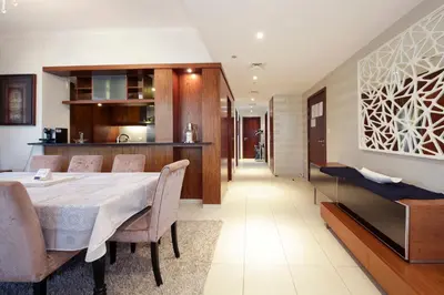 a dining room with a table and chairs at New Arabian Burj Residence 1 & 8 Downtown Dubai in Dubai