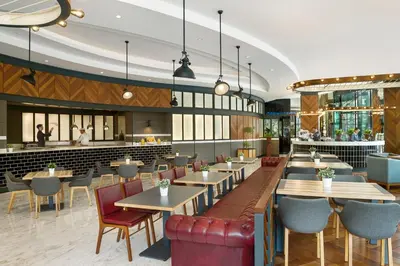 a rendering of a restaurant with tables and chairs at DAMAC Maison Distinction in Dubai