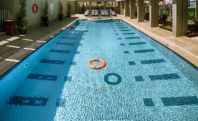 a large swimming pool with an orange ball in it at Rose Park Hotel - Al Barsha, Opposite Metro Station in Dubai