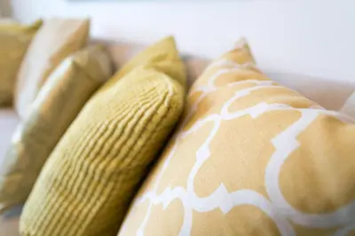a group of pillows sitting on a couch at Near Burj Khalifa, DownTown - Burj Al Nujoom in Dubai