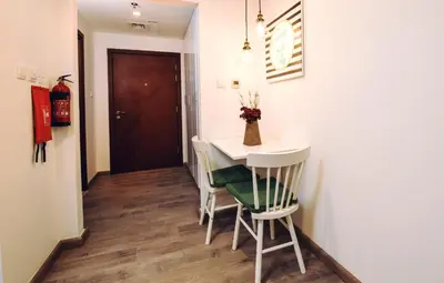 a small dining room with a table and chairs at Near Burj Khalifa, DownTown - Burj Al Nujoom in Dubai