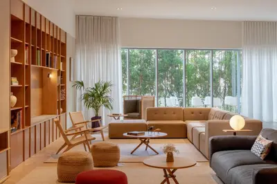 a living room with a couch and a table at Staybridge Suites Dubai Internet City by IHG in Dubai