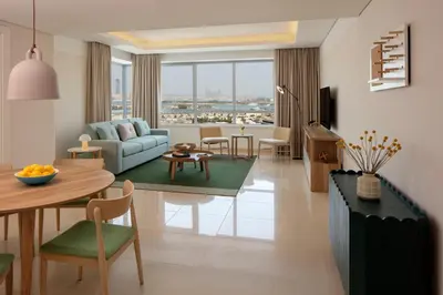 a living room with a couch and a table at Staybridge Suites Dubai Internet City by IHG in Dubai