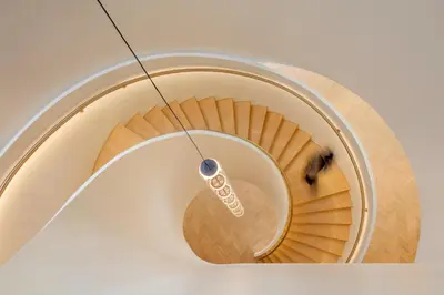 a spiral staircase with a sign on it at Staybridge Suites Dubai Internet City by IHG in Dubai