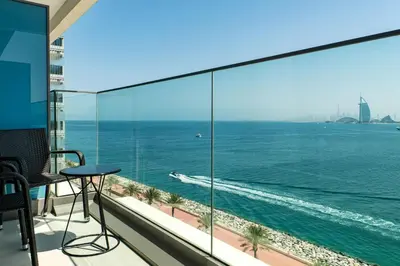 a balcony with a view of the ocean at Aloft Palm Jumeirah in Dubai