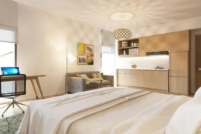 a bedroom with a bed and a living room at Element Me'aisam, Dubai in Dubai