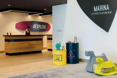 a store with a man standing at a counter at Rove Dubai Marina in Dubai