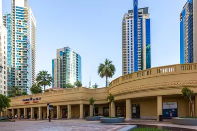 a building in a city with tall buildings at ELAN Rimal 3 Suites in Dubai
