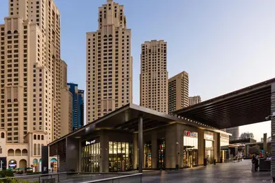 a building in a city with tall buildings at ELAN Rimal 3 Suites in Dubai