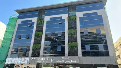 a tall building with a lot of windows at President Hotel in Dubai