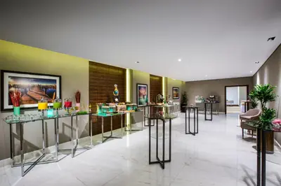 a lobby with a bunch of glasses on display at The Tower Plaza Hotel Dubai in Dubai
