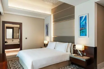 a hotel room with a bed and a bathroom at Renaissance Business Bay Hotel, Dubai in Dubai