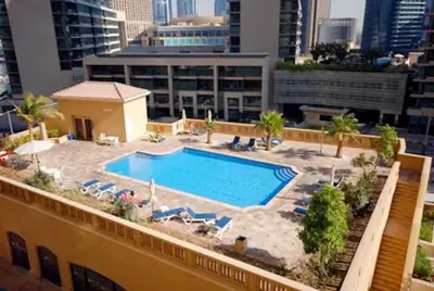 a swimming pool on the roof of a building at 2br Beach front Sea View in Dubai