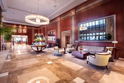 a lobby of a hotel with couches and chairs at Stella Di Mare Dubai Marina Hotel in Dubai