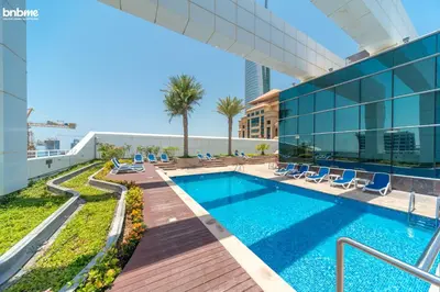 a swimming pool on the roof of a building at bnbmehomes - Gold Crest Views 2 in Dubai