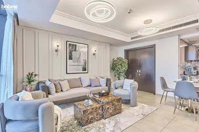 a living room with a couch and chairs and a table at bnbmehomes - Gold Crest Views 2 in Dubai