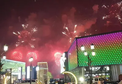 a firework display in a city at night at Murjan Suites Waterfront Jumeirah Beach Residence The Walk & Dubai Eye & Beach & Marina in Dubai