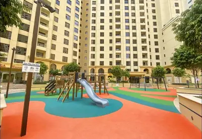 a playground in a city with a slide at Murjan Suites Waterfront Jumeirah Beach Residence The Walk & Dubai Eye & Beach & Marina in Dubai